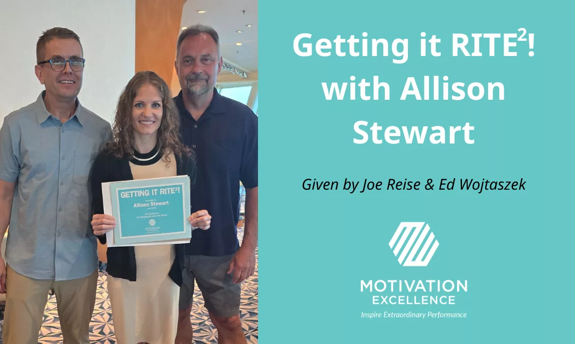 A photo of three colleagues with the one in the middle holding an award certificate.